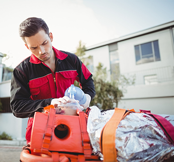 paramedic giving oxygen injured woman