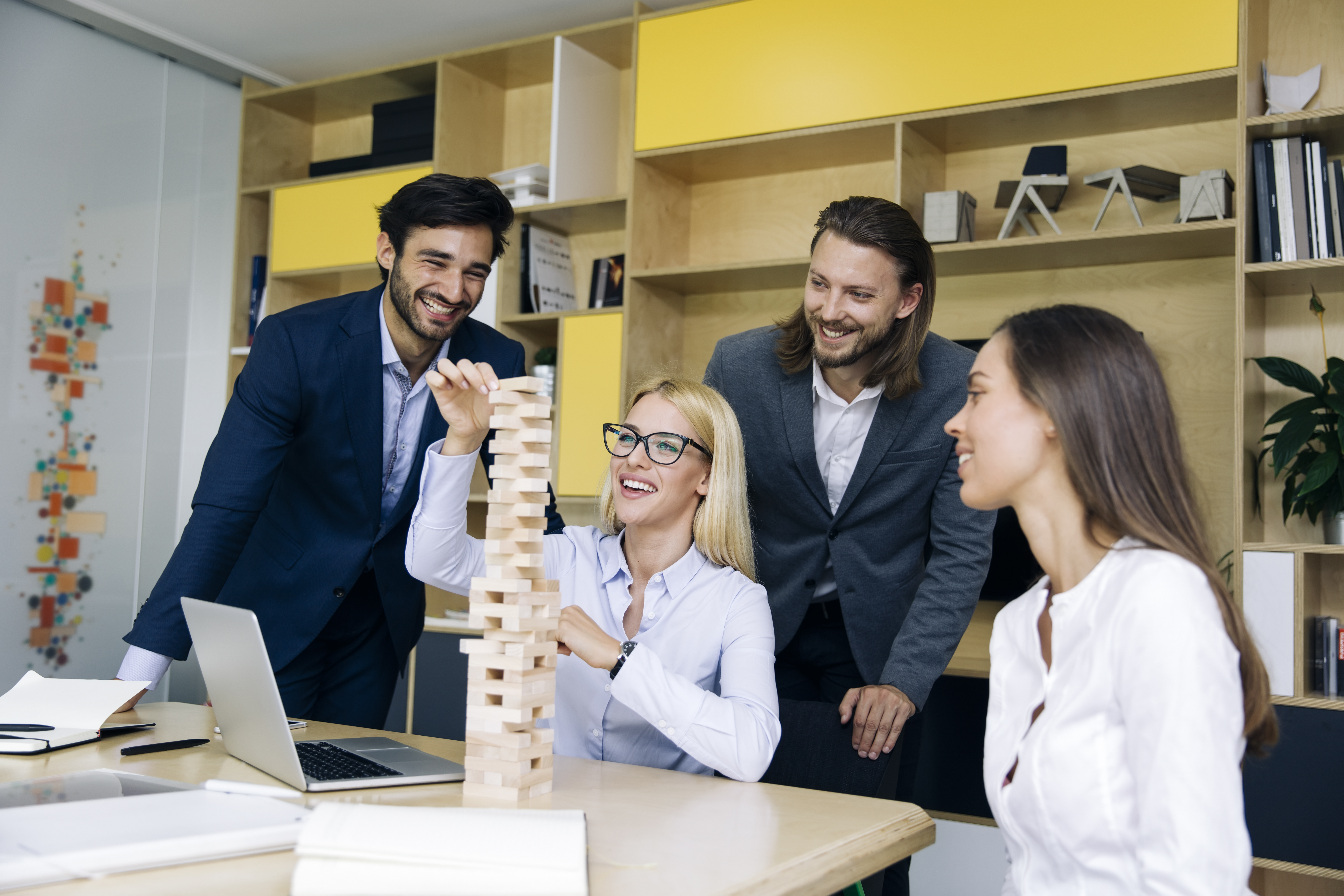 team of young business people build a wooden construction