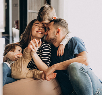 young family with their sons home having fun